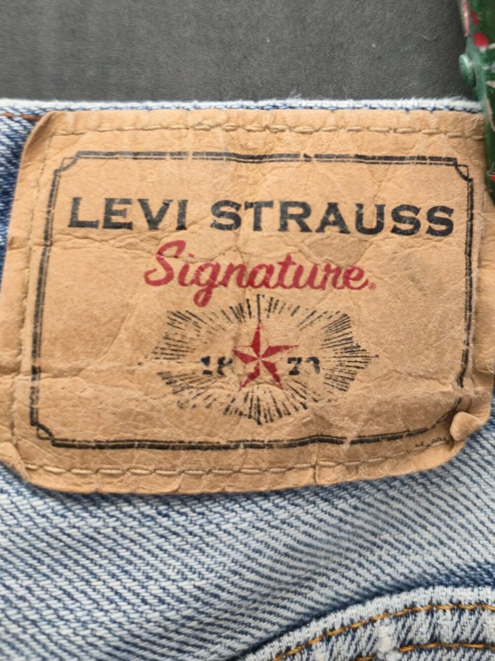 Levi Strauss Signature jeans feature a classic light-wash acid-wash